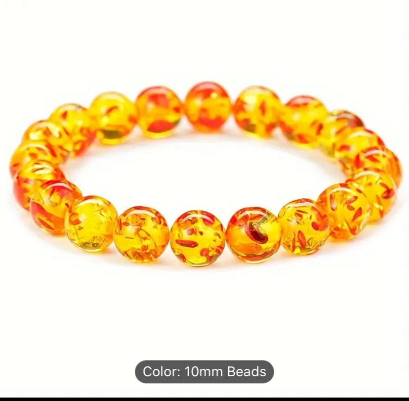 Yellow and orange bead bracelet.
